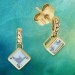 585 Gelbgold Ohrstecker mit Diamanten und einem schönen Blautopas