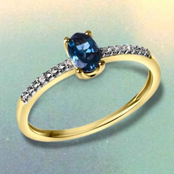 Diamanten Ring aus 585 Gelbgold mit echtem blauen Topas